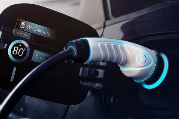 Close-up of an electric vehicle charging with a plug connected, highlighting the car charging installation. A display shows the battery at 80% with just 5 seconds left until full charge.